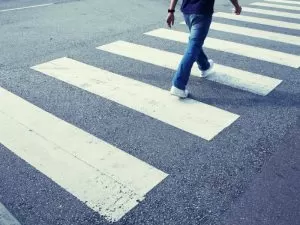 person walking in a crosswalk