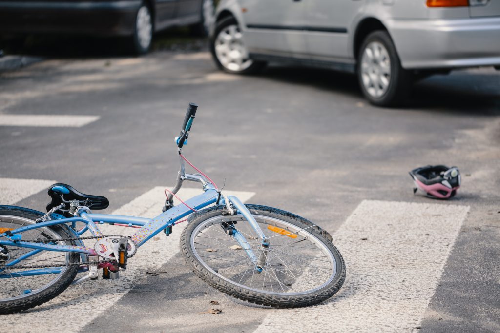 bicycle laying in a cross walk after a bike accident